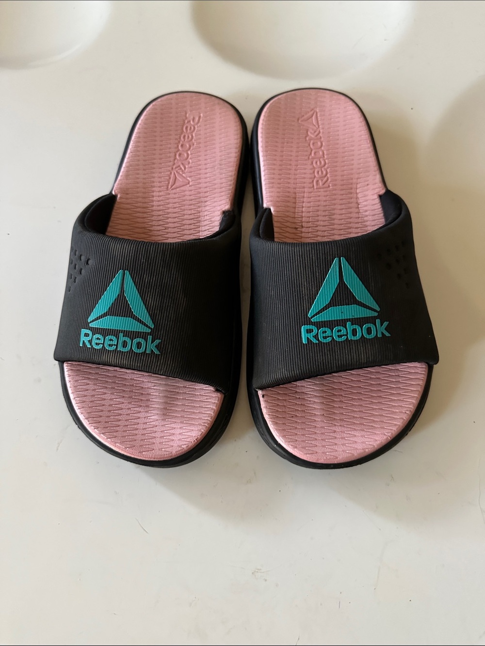 Reebok Black Slide Sandals with Pink Footbed and Teal Logo